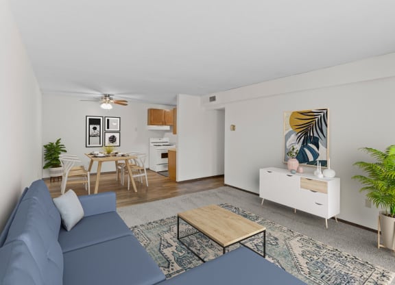a living room with white walls and a blue couch