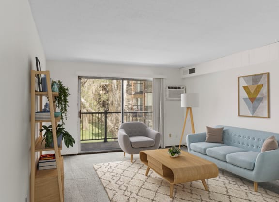 a living room with white walls and a sliding glass door