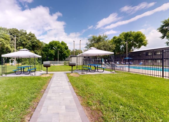 take a dip in the pool at whispering pines apartments in pearland, tx