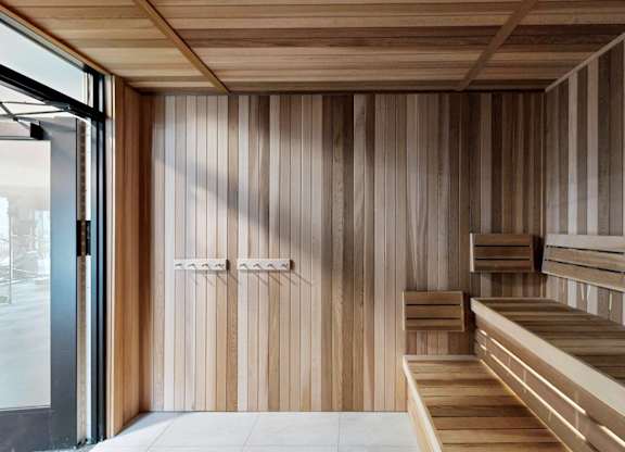 A room with wooden walls and benches.
