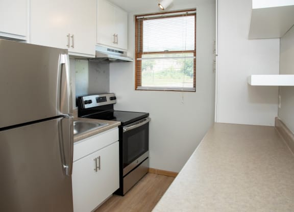 studio kitchen with floating shelves