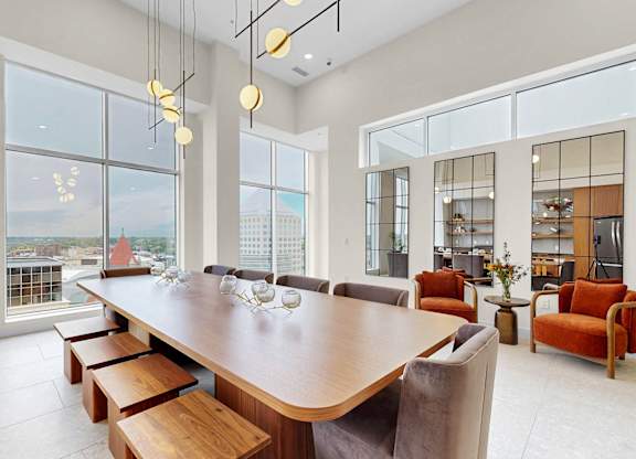 A large conference room with a long table and chairs.