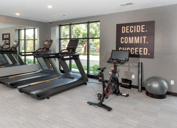 a gym with treadmills and other exercise equipment at The Exchange Apartments, Minnesota, 55112