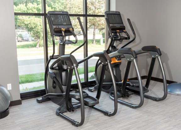 a row of exercise bikes at The Exchange Apartments, New Brighton, 55112
