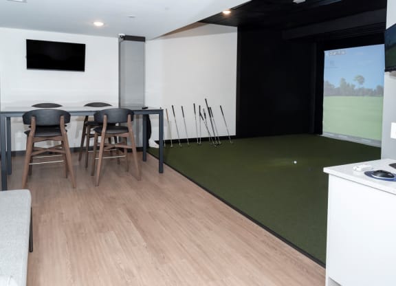 Golf Simulator With Table at The Exchange Apartments, New Brighton, MN