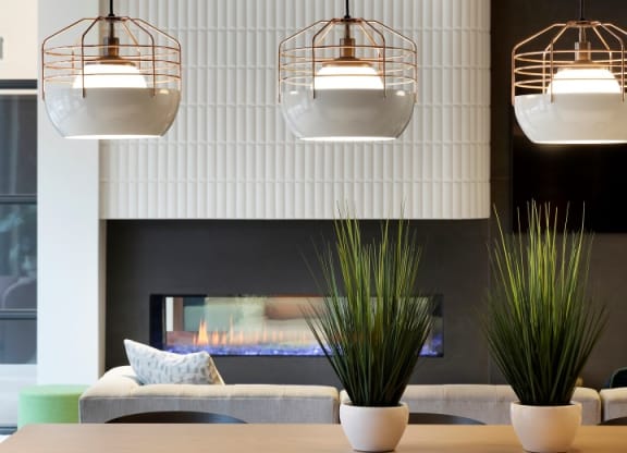 Community Lounge Area With Plants and Lighting at The Hill Apartments in St Paul, MN