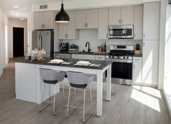 Fitted Kitchen With Island Dining at The Hill Apartments, Saint Paul