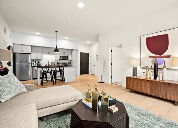 Modern Living Room With Kitchen View at The Hill Apartments, Saint Paul, MN