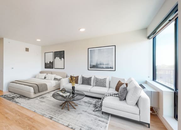 a living room with two couches and a glass coffee table at The Mason, Minnesota