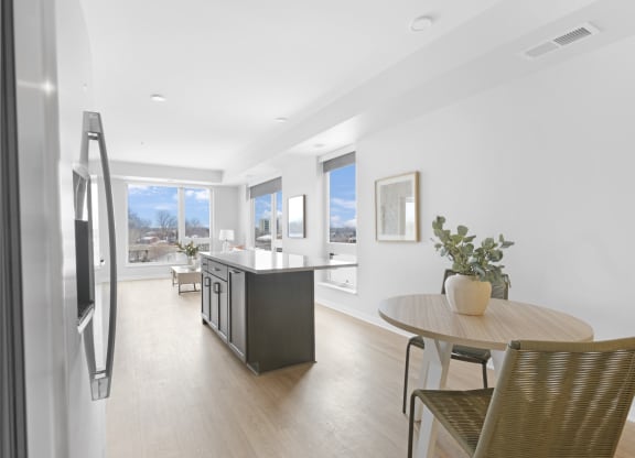 a kitchen and dining area in a 555 waverly unit