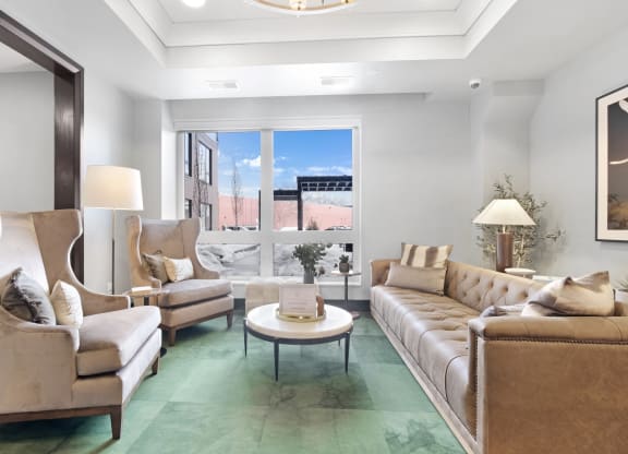 a living room with couches chairs and a coffee table