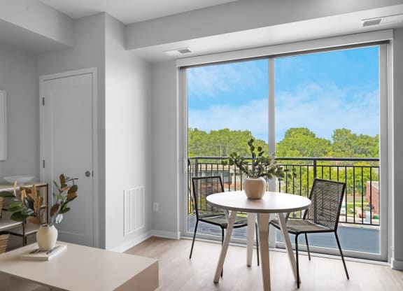 a seating area with a table and chairs in a 555 waverly unit