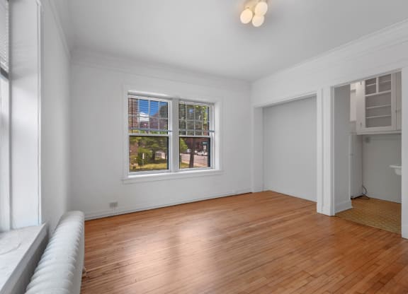 a living room with a couch and a window