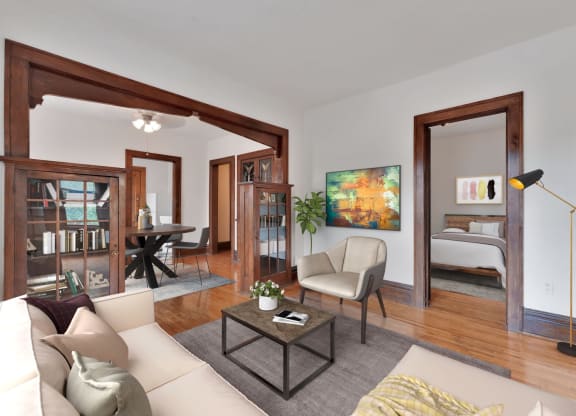 a living room filled with furniture and a large window