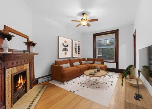 a living room with a couch and a fireplace