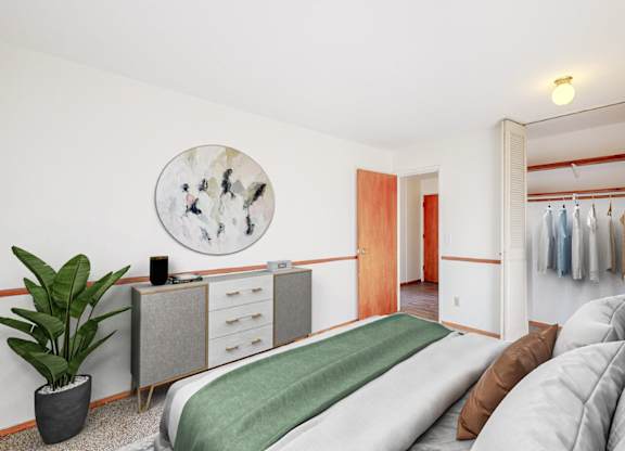 a bedroom with a bed and a closet