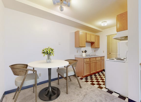 a kitchen and dining area in a 555 waverly unit