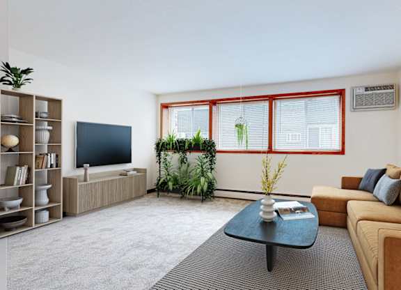 A living room with a brown couch, a black coffee table, and a red window.