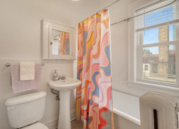 a bathroom with a toilet sink and bathtub