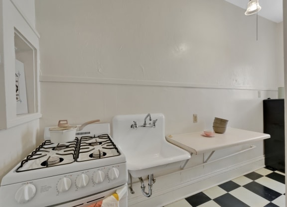 a kitchen with a stove and a sink