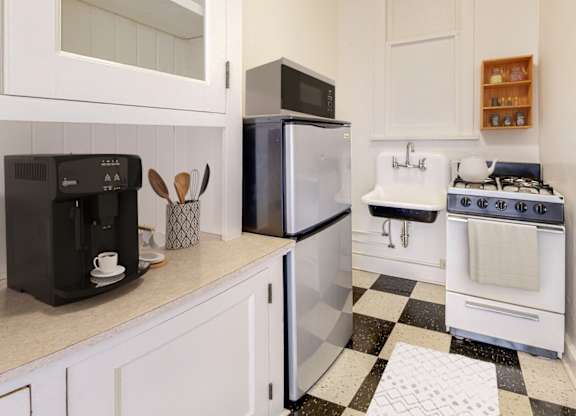 A black and white checkered floor in a kitchen.