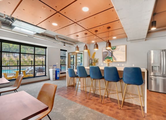 the yards and backyards commons community room with bar stools