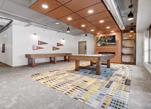 a game room with a pool table and ping pong