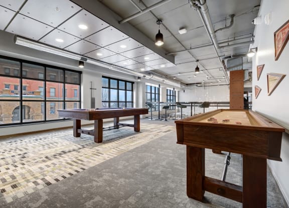 a games room with shuffleboard tables and ping pong tables at The Yards and Backyards, Saint Paul, MN