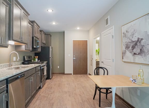 a kitchen and dining area at The Yards and Backyards, Saint Paul, MN