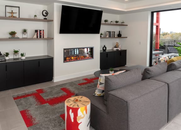 a living room with a couch and a fireplace at Tyler Street Stacks, Minneapolis, 55413