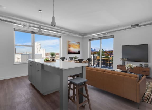 an open living room with a kitchen island and a living room at Tyler Street Stacks, Minneapolis, MN 55413