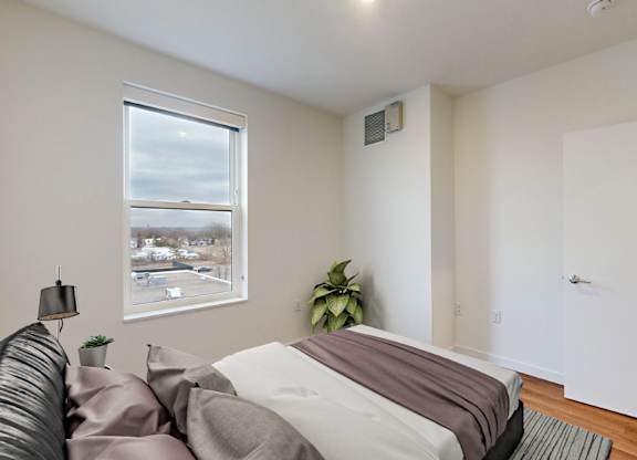 Bedroom With Expansive Windows at Tyler Street Stacks, Minneapolis, MN
