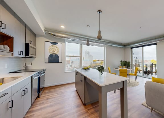 a living room with a kitchen and a dining room at Tyler Street Stacks, Minneapolis Minnesota