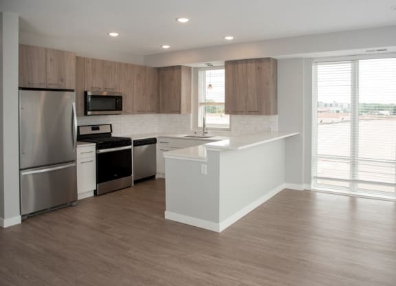 2 bedroom marc floor plan corner apartment with spacious kitchen, over the sink window and breakfast bar at Urban Park I and II Apartments, St Louis Park