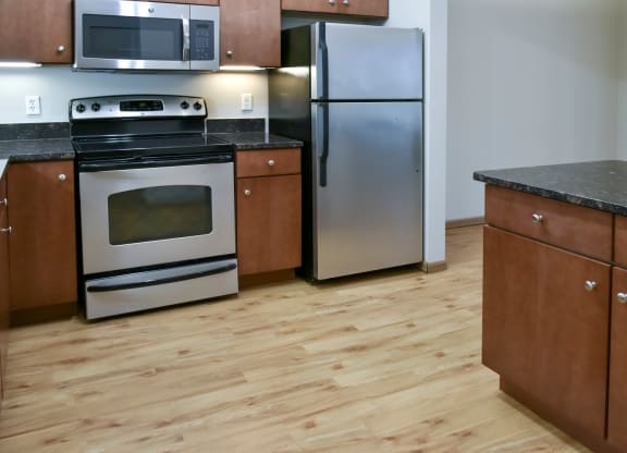 Traditional kitchen with wood look flooring
