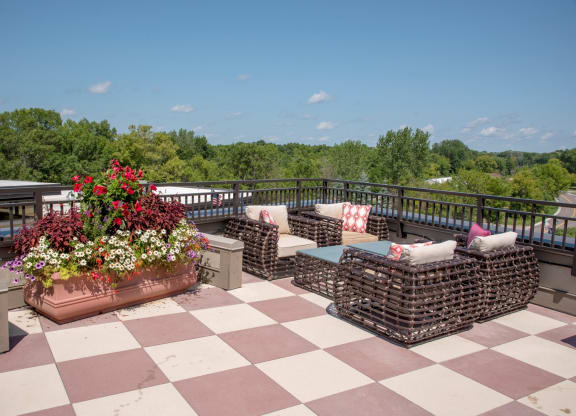 Rooftop patio flower beds and cushioned seating at Victoria Flats, Victoria, MN 55386