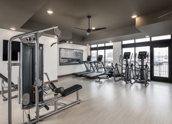 a room filled with lots of different types of exercise equipment