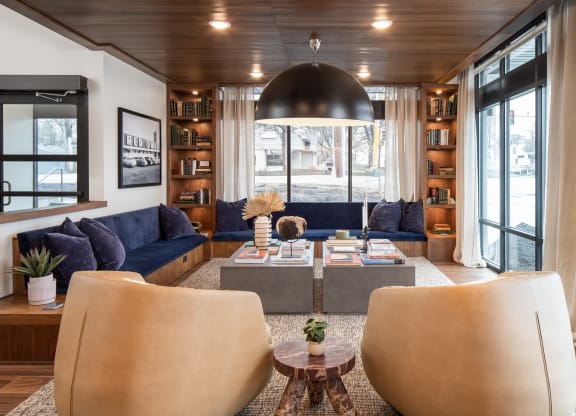 a living room filled with furniture and a large window
