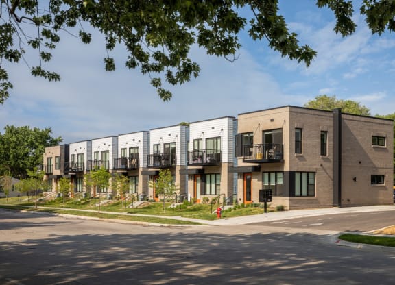 a row of apartment buildings on a street