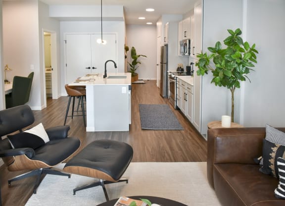 a living room and kitchen area in an apartment