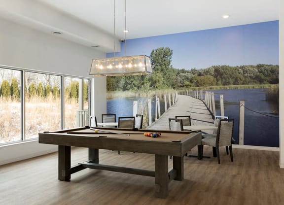Bright windows illuminating gaming area in apartment building at Waterstone Place in Minnetonka