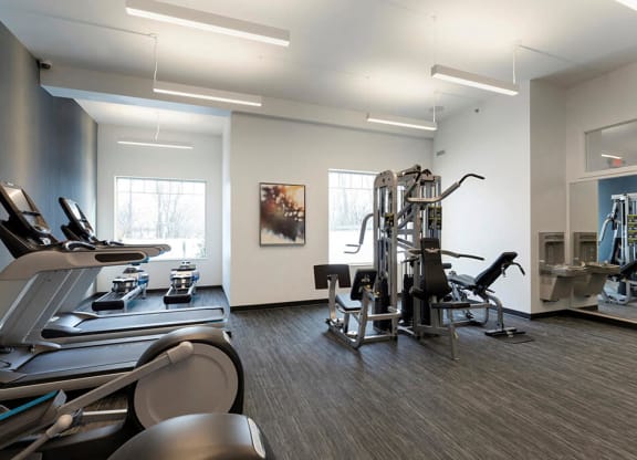 Multi-functional gym with 5 equipment stations for strength training at Waterstone Place in Minnetonka, MN