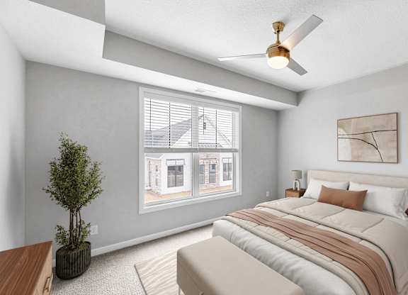 A bedroom with a bed, nightstand, and a plant.