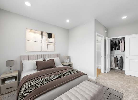 A bedroom with a large bed and a wardrobe.