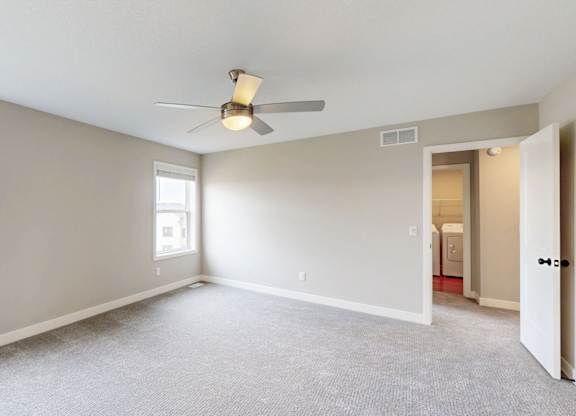 Bedroom with walk-in closet and ensuite bathroom access at Wildwood Lakeville Apartments, Lakeville, MN 55044