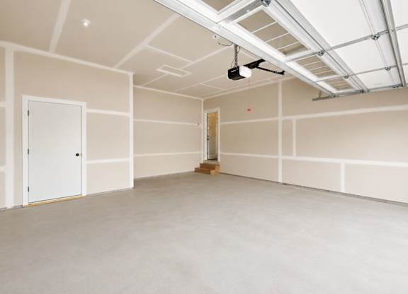 Finished garage with drywall and door at Wildwood Lakeville Apartments, Lakeville, 55044