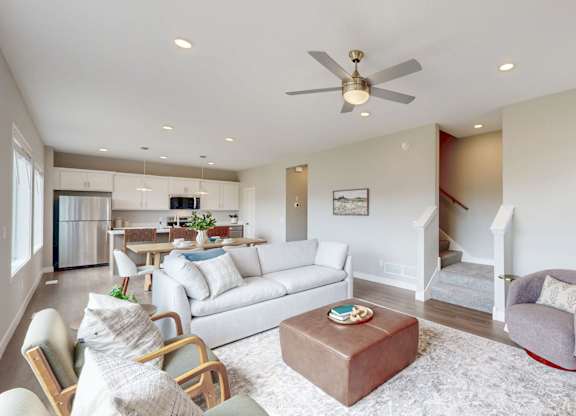 Open floor plan with kitchen and seating areas at Wildwood Lakeville Apartments, Lakeville, Minnesota
