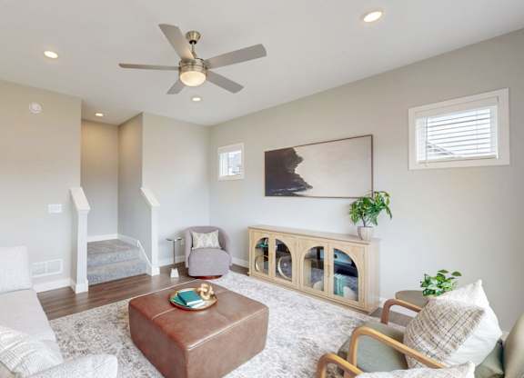 Loft living space with modern decor and ceiling fan at Wildwood Lakeville Apartments, Lakeville, MN 55044