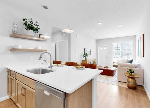 A modern kitchen with wooden cabinets and a white countertop.