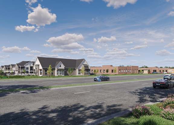 Community entrance and parking area at Wildwood Lakeville Apartments, Lakeville, MN